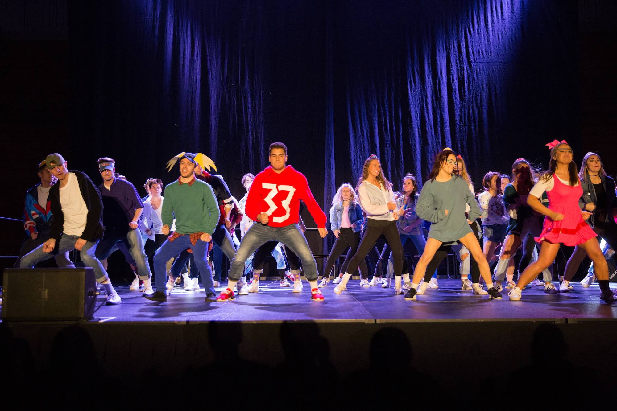 Greek life students dancing on stage at the lip syncing battle